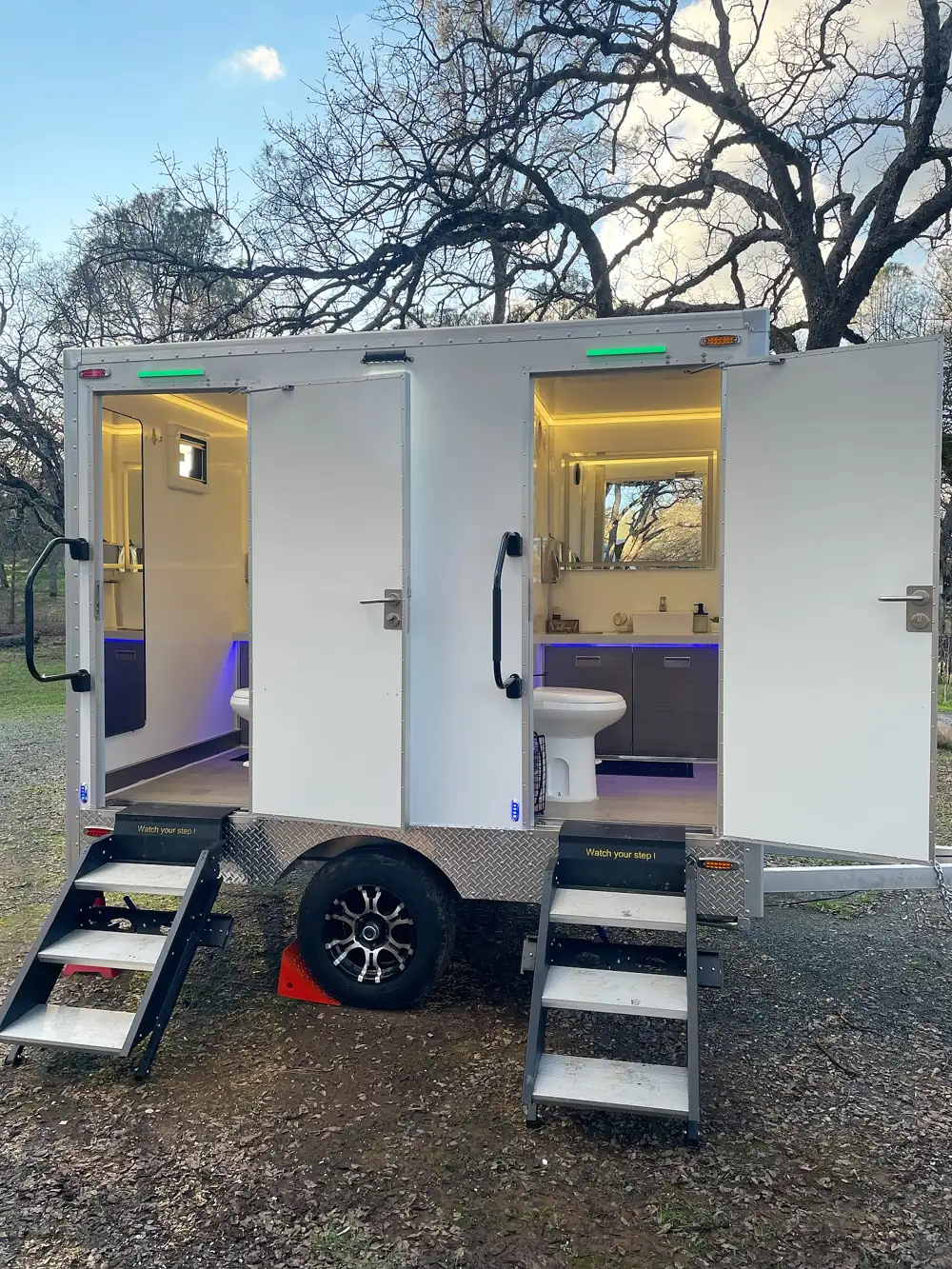 Two-door restroom trailer with lights